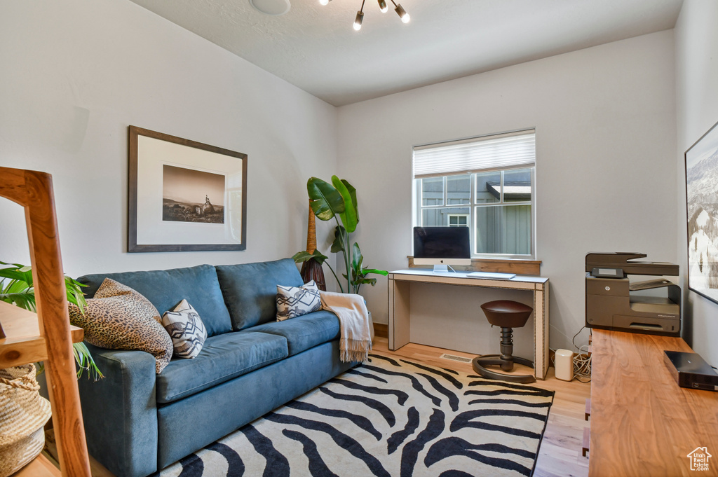 Office space featuring wood finished floors