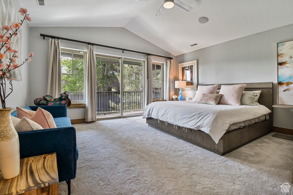 Bedroom featuring access to exterior, lofted ceiling, carpet floors, baseboards, and ceiling fan