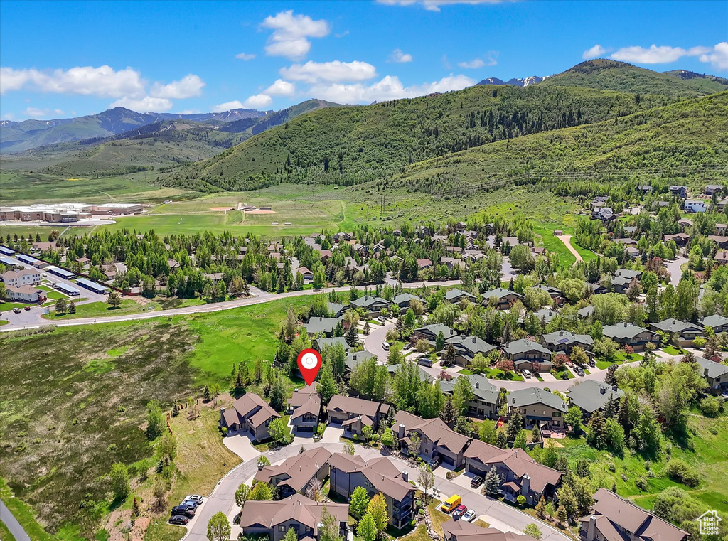 Aerial view of residential area featuring a mountainous background