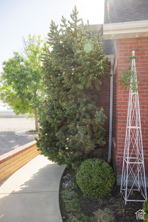 View of side of home with brick siding