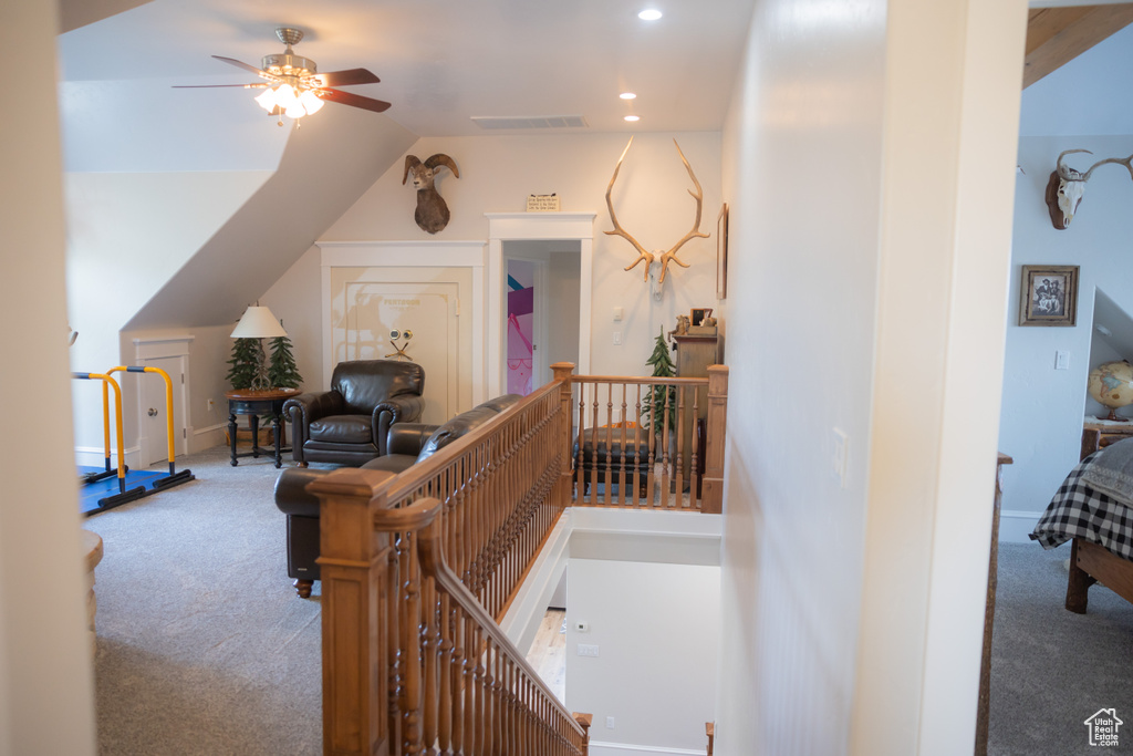 Hall featuring carpet, an upstairs landing, recessed lighting, and lofted ceiling