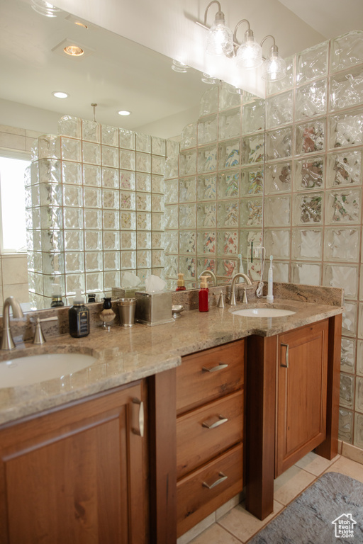Bathroom featuring double vanity and tile patterned floors