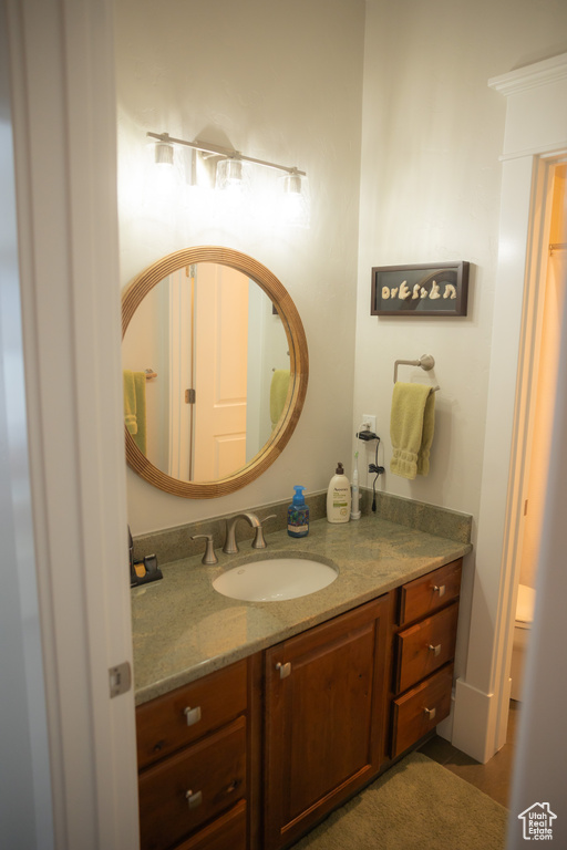 Bathroom featuring vanity and toilet