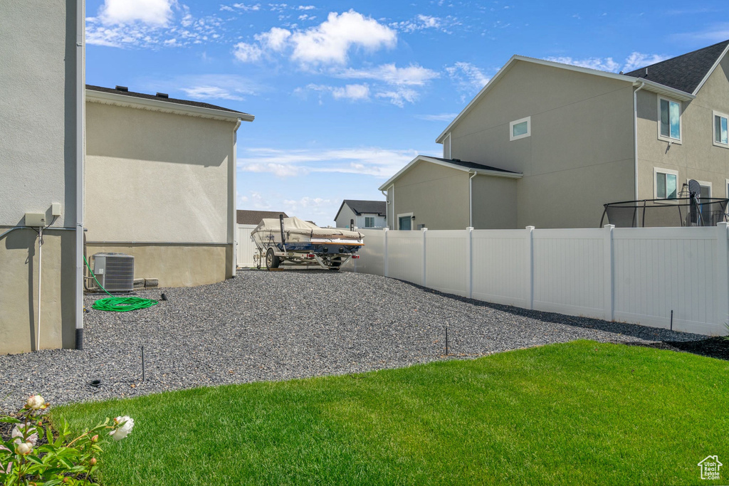View of yard with central AC