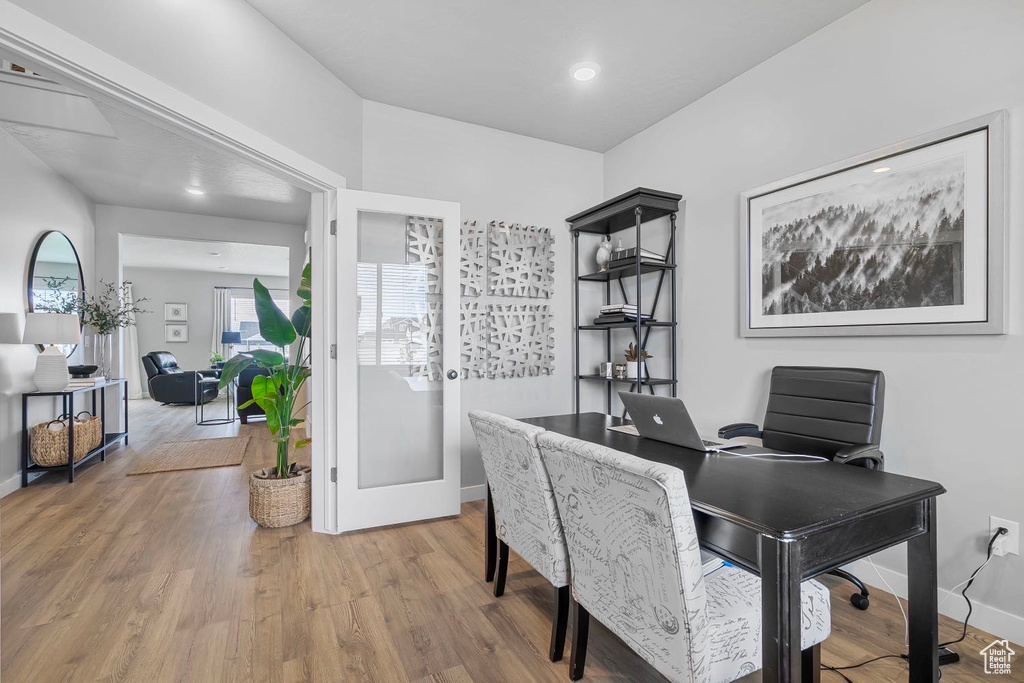 Office featuring wood finished floors, baseboards, and recessed lighting
