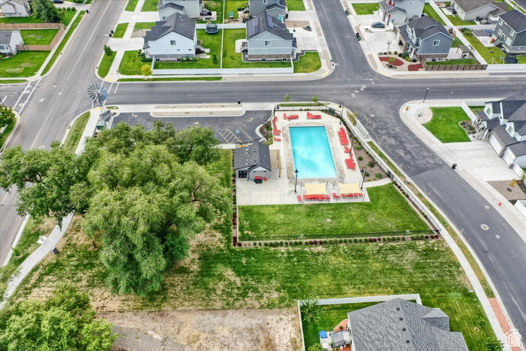 Aerial view of residential area featuring a pool