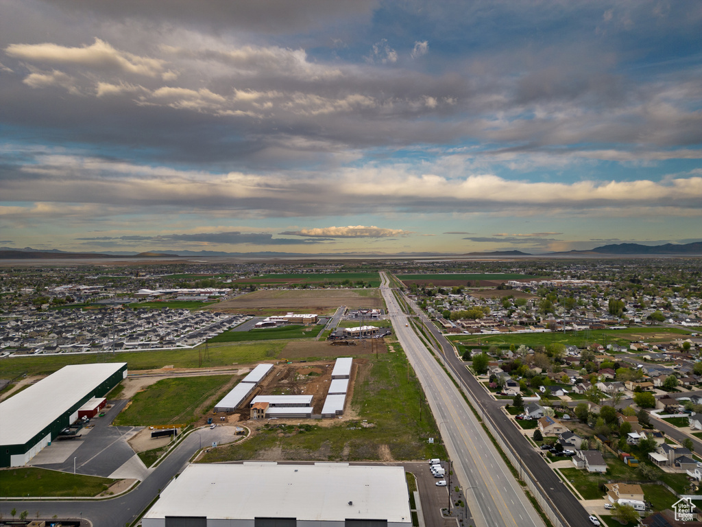Aerial view of property's location with a mountain backdrop
