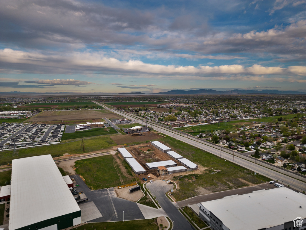 Aerial overview of property's location featuring a mountainous background