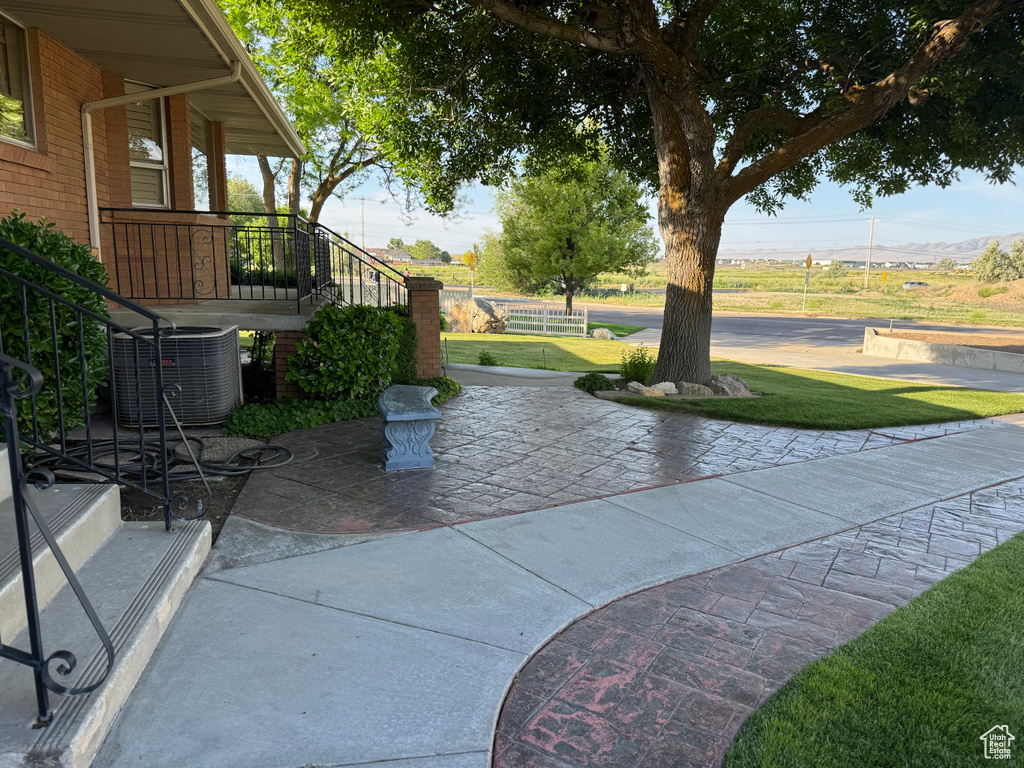 View of patio / terrace featuring central air condition unit and stairs