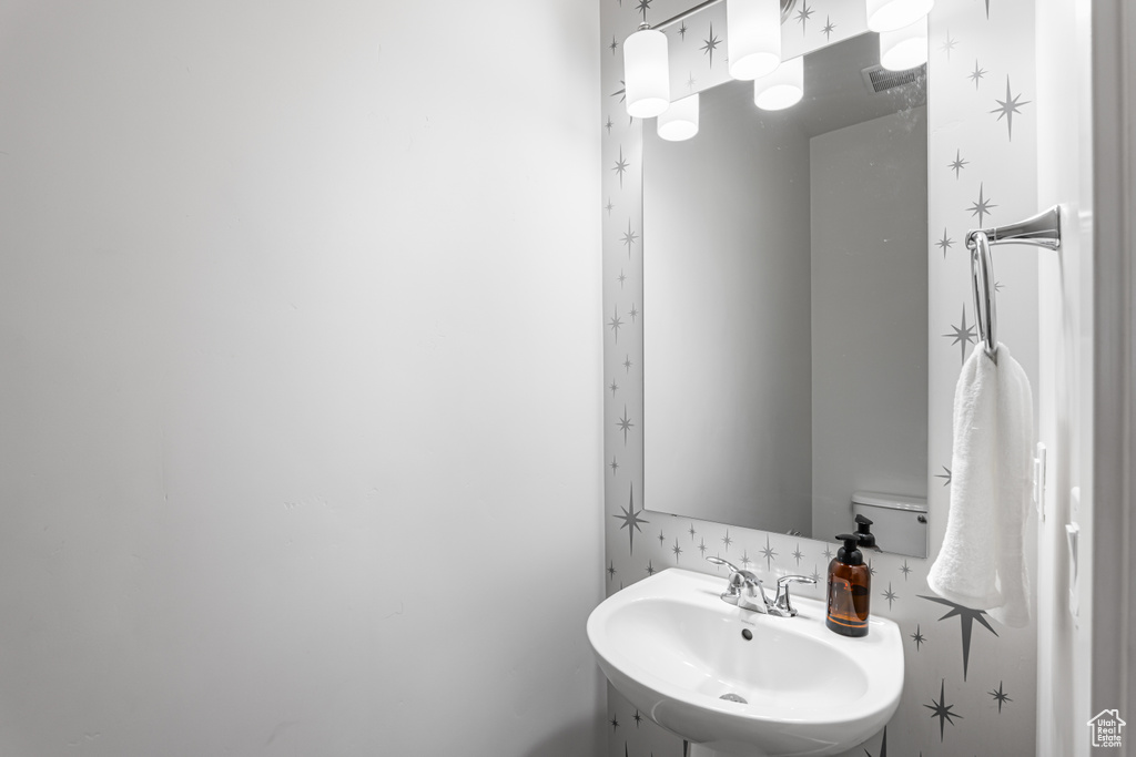 Half bathroom featuring a sink