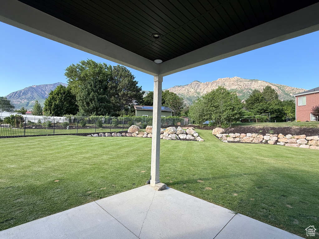 View of yard with a mountain view and a patio area
