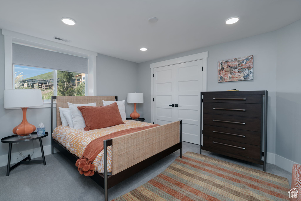 Bedroom featuring baseboards, recessed lighting, and a closet