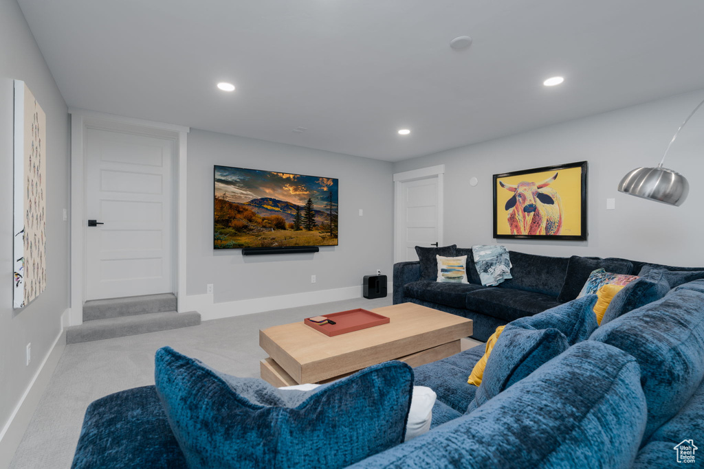 Living area featuring recessed lighting, carpet, and baseboards