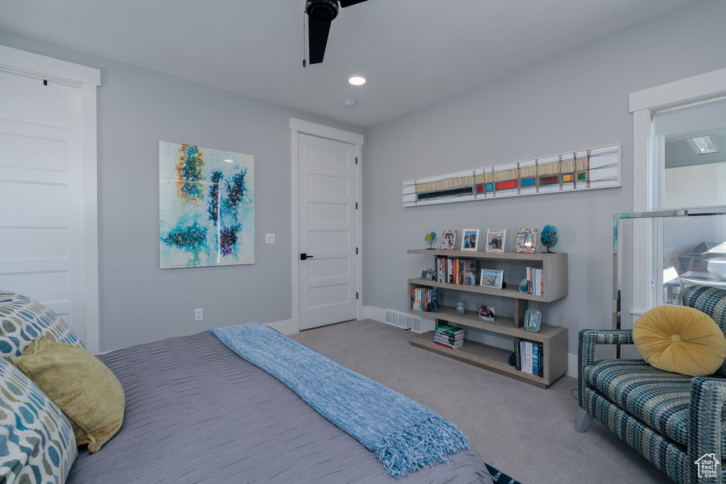 Carpeted bedroom featuring recessed lighting, ceiling fan, and baseboards