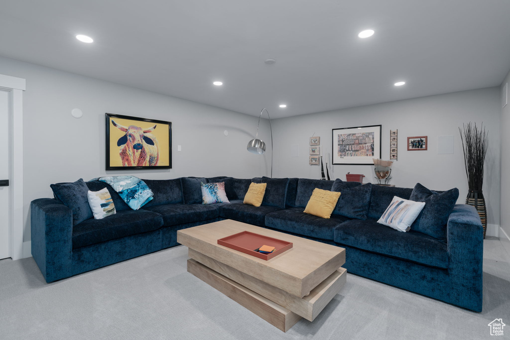 Living room with recessed lighting and carpet