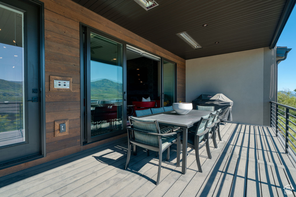 Deck with grilling area and outdoor dining space