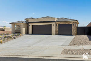 Prairie-style house featuring an attached garage and concrete driveway