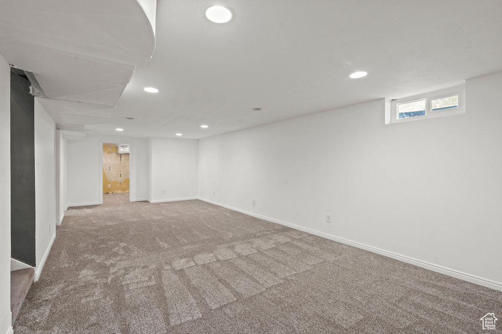 Below grade area with recessed lighting, carpet flooring, and baseboards