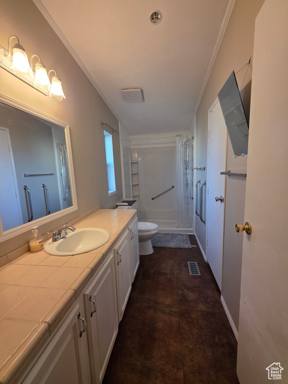 Bathroom with vanity, toilet, and crown molding