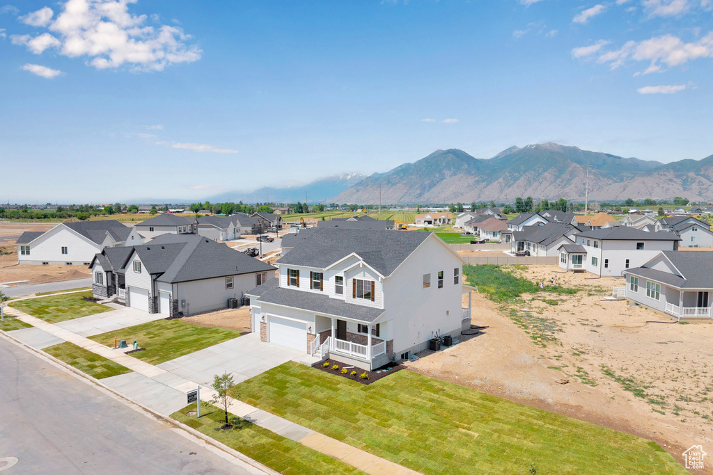 Aerial view of residential area featuring a mountainous background