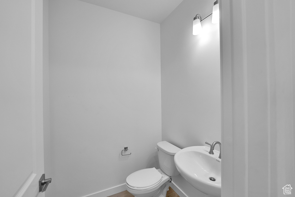 Bathroom featuring a sink and toilet