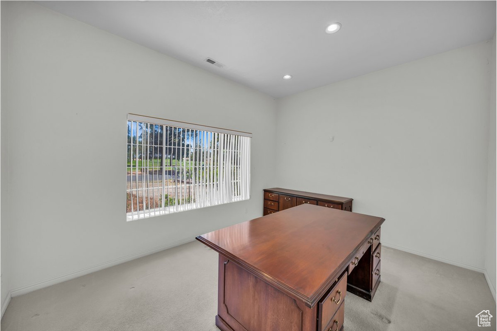 Home office featuring light colored carpet, recessed lighting, and baseboards