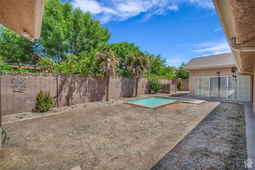 Fenced backyard featuring a patio area