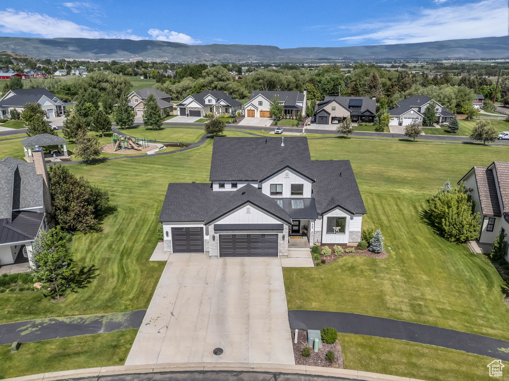 Aerial view of residential area featuring a mountain backdrop