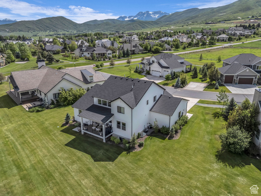 Aerial view of residential area featuring a mountain backdrop