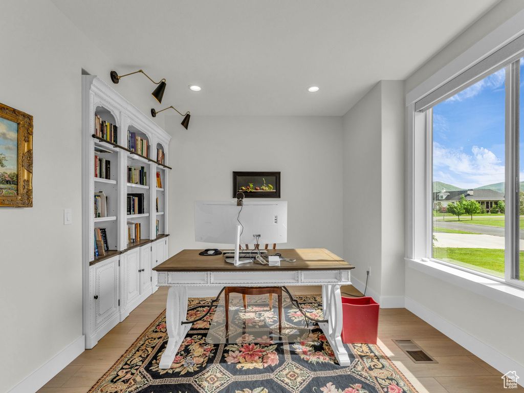Home office featuring light wood-type flooring, recessed lighting, and baseboards