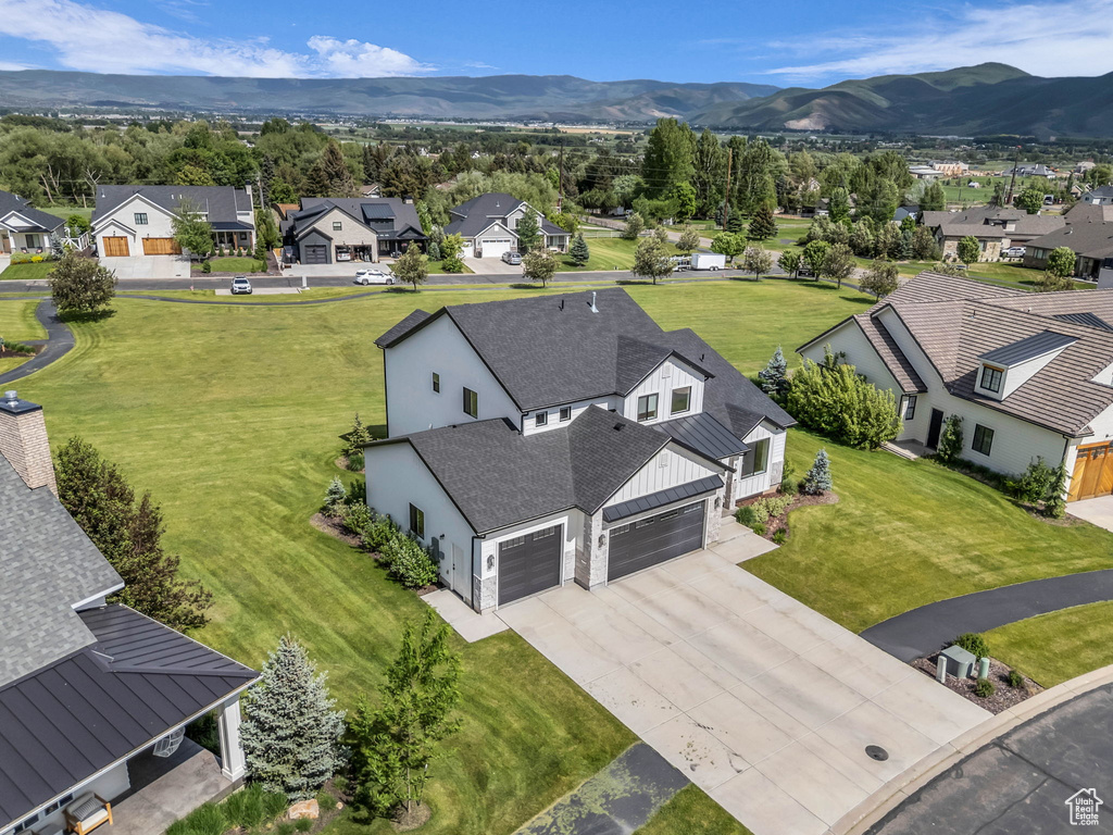 Aerial perspective of suburban area with a mountain backdrop