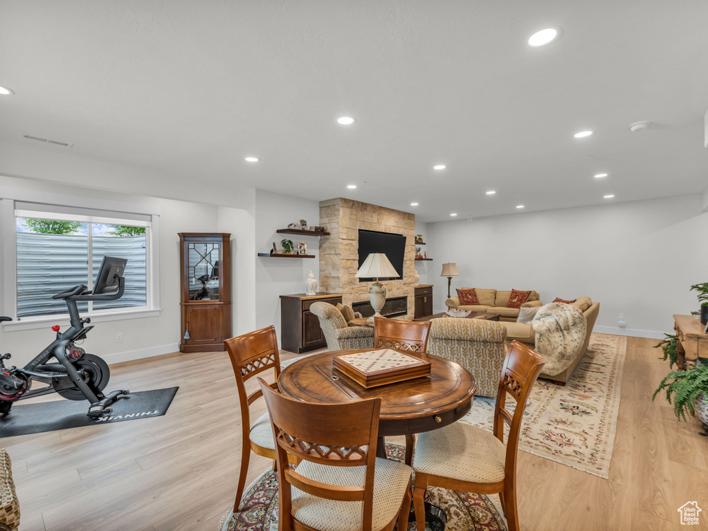 Dining room featuring light wood-type flooring, baseboards, and recessed lighting