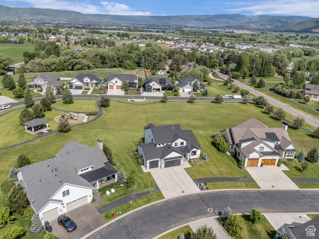 Aerial perspective of suburban area with a mountain backdrop