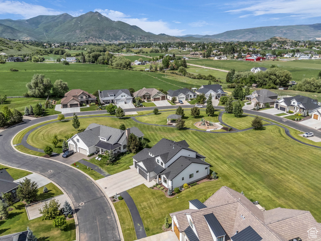 Aerial view of residential area featuring mountains