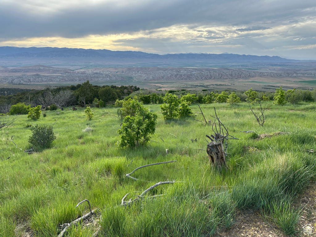 View of mountain backdrop featuring rural landscape