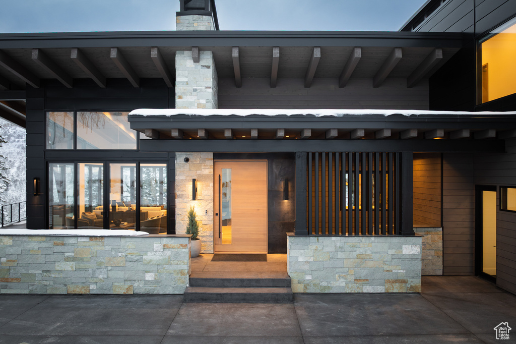 View of exterior entry with stone siding