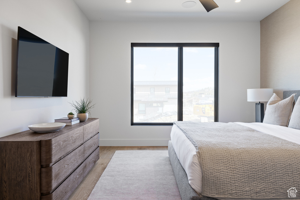 Bedroom featuring light wood-type flooring, recessed lighting, and baseboards