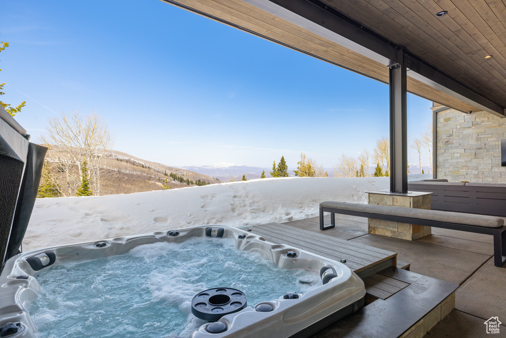 View of patio / terrace featuring an outdoor hot tub