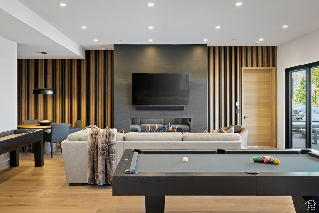 Game room featuring billiards, recessed lighting, light wood-type flooring, and an accent wall