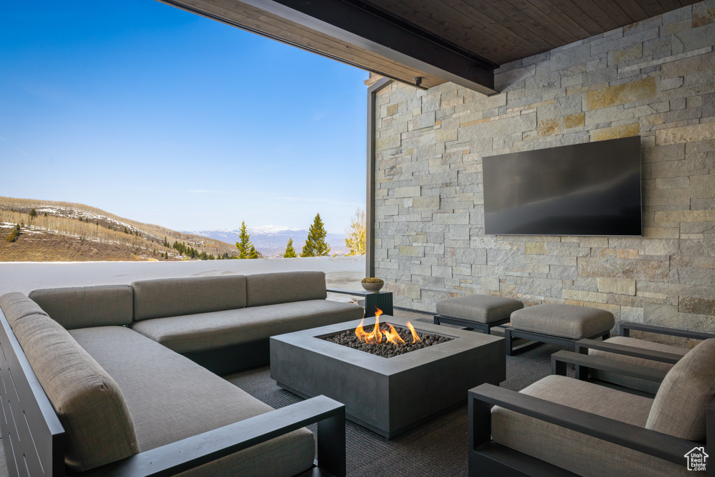 View of patio / terrace featuring an outdoor living space with a fire pit