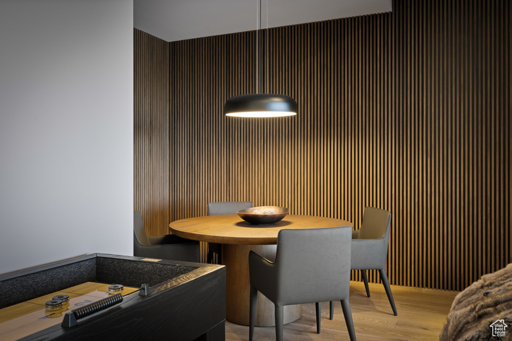 Dining area with light wood-style flooring