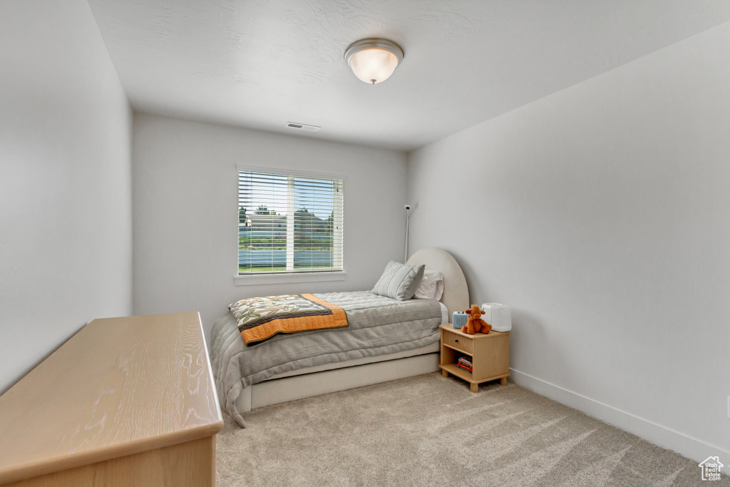 Bedroom with carpet and baseboards