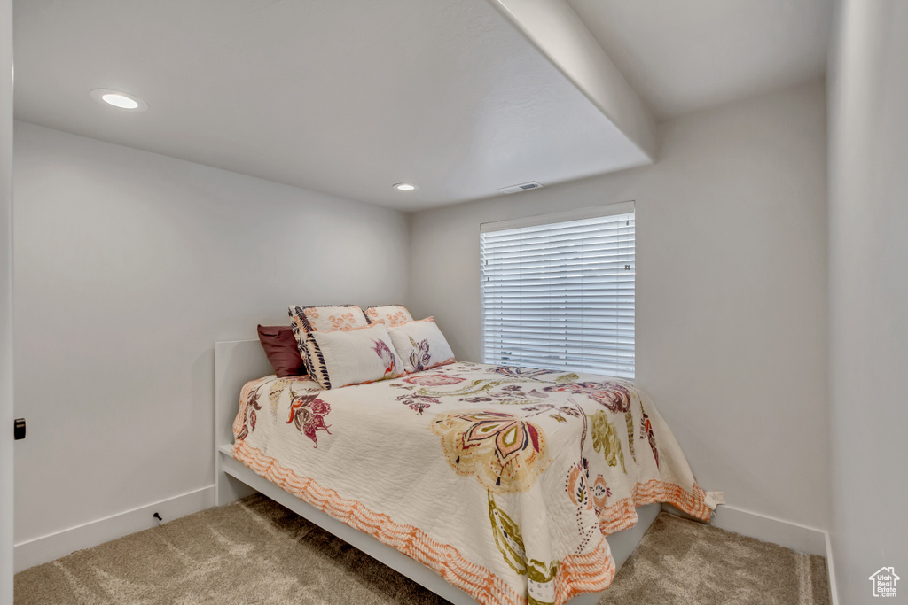 Bedroom featuring carpet flooring, baseboards, and recessed lighting