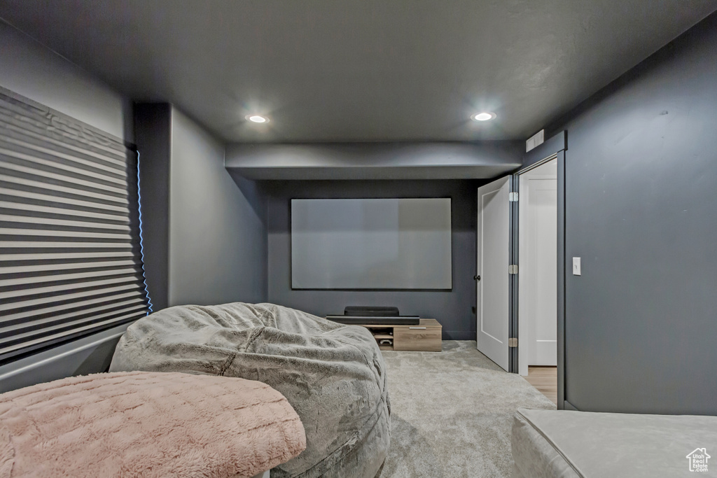 Cinema featuring recessed lighting and carpet flooring