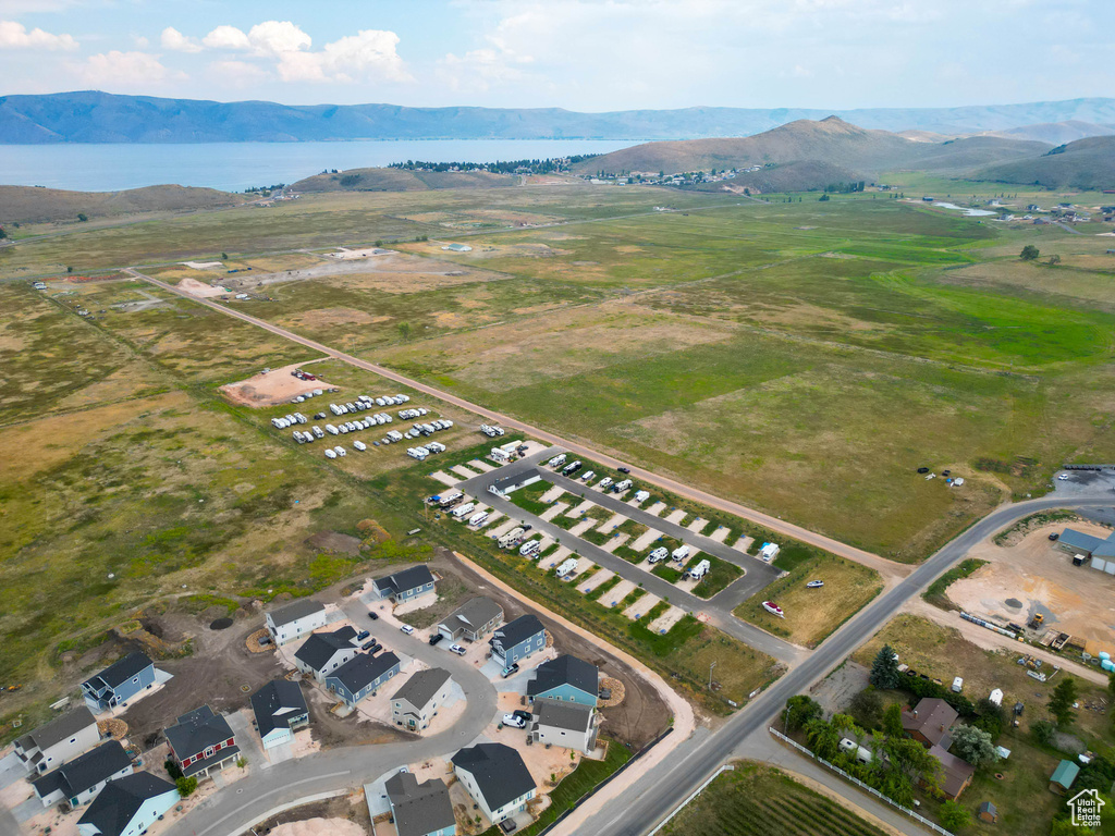 View of property location featuring a water and mountain view