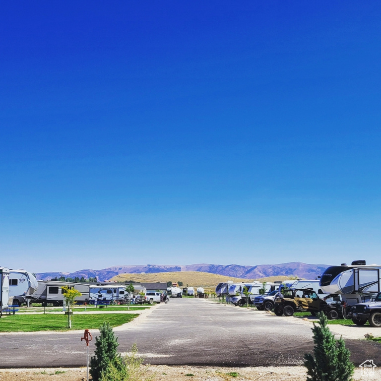 View of mountain backdrop featuring nearby suburban area