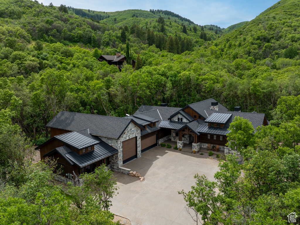 View of subject property featuring a forest
