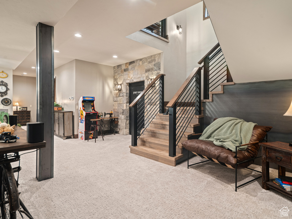 Stairs with carpet floors, a fireplace, and recessed lighting