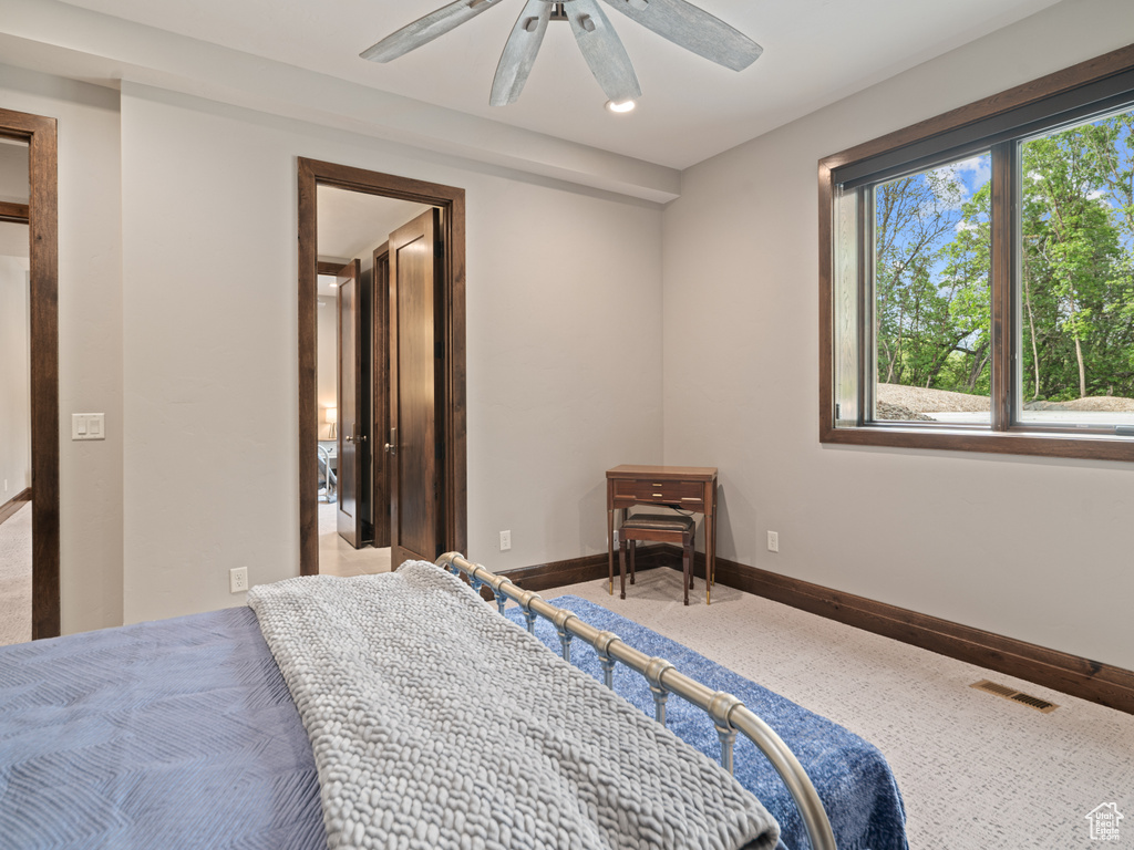 Bedroom featuring baseboards and ceiling fan