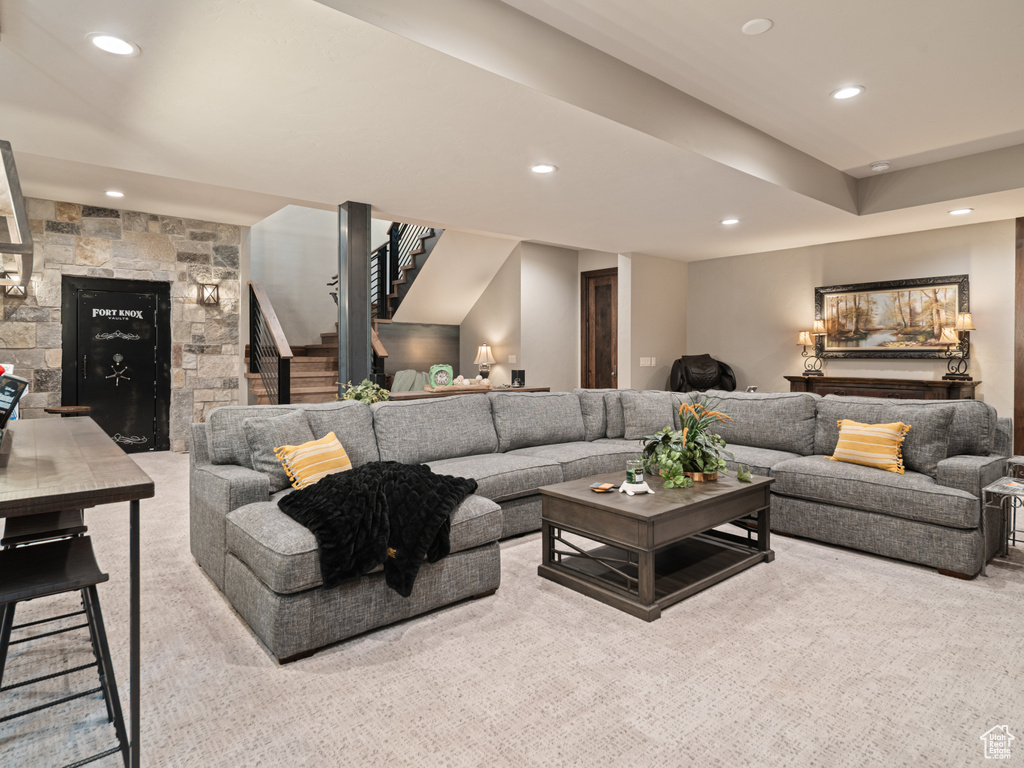 Living room with stairs, recessed lighting, carpet, and a fireplace